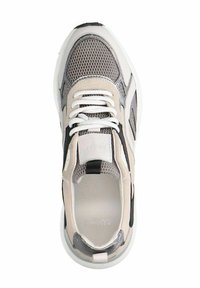 Gray and beige athletic shoe with mesh upper, white laces, and black accents. Thick sole with rounded shape, featuring a textured finish.