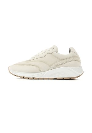 Beige leather sneaker with white thick sole and gum outsole, featuring stitching details and lace-up closure, shown in profile view.