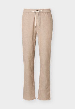 Priložene hlače iz bež mešanice platna s prožnim pasom in belim vrvico za zatezanje, z ravnim krojem nogavic, brez vidnih žepov, prikazane na belem ozadju.