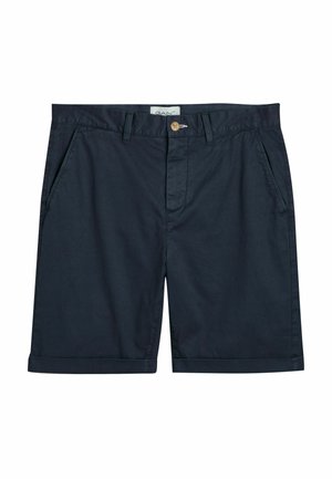 Pantalones cortos de algodón azul marino con cierre de botón, dos bolsillos laterales y dobladillos vueltas. Textura suave con un diseño ajustado.