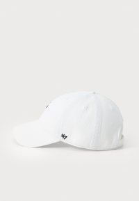 White cotton baseball cap with a structured crown, curved visor, embroidery detail on the front, and adjustable strap at the back.