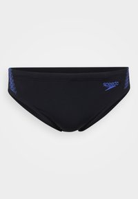Maillots de bain noirs en tissu extensible, arborant le logo Speedo bleu et un motif en zigzag sur le côté gauche. Design élégant et texture lisse.