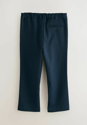 Navyblauwe broek met een gladde textuur, elastische tailleband en één achterzak met een knoop. Rechte pijpen.