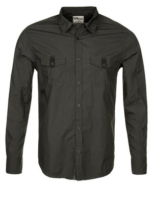 Dark green long-sleeve button-up shirt with collar and two front buttoned chest pockets, displayed on a white background.