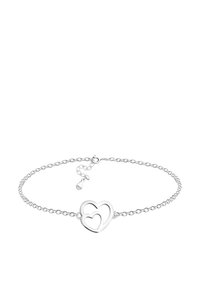 Silverarmband med två sammanflätade hjärtan, delikat kedjedesign och en liten tagg med stämplingen.