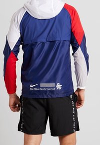 Nike Performance Chaqueta de running - dark blue