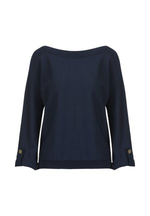 Tamsiai mėlynas mezgintas megztinis su plačiu iškirpte, trijų ketvirčių dolmano rankovėmis ir auksiniais mygtukais ant susuktų rankogalių. Lygus tekstūros paviršius.