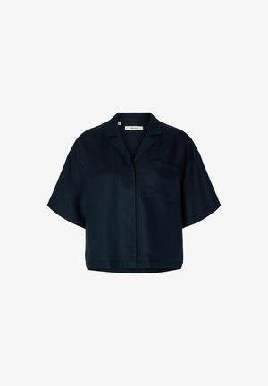 Chemise à manches courtes bleu marine foncé avec boutonnière, col et une unique poche poitrine, présentée sur un fond blanc uni.