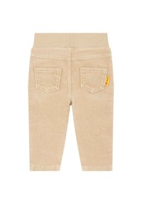 Béžové kordové kalhoty s měkkým elastickým pasem, dvěma zadními kapsami a malou žlutou etiketou jako akcentem. Hladký povrch s jemnými žebry.