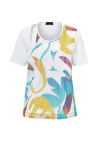 Korte mouw T-shirt met een witte stofbasis, met een veelkleurig abstract bloemmotief met gele, blauwe en paarse accenten.