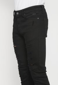 Koroshi Oprijete (skinny) kavbojke - denim black denim