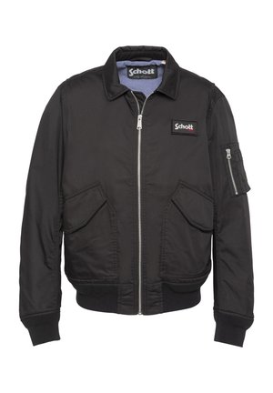 Chaqueta bomber negra con cremallera, dos bolsillos frontales con solapa, bolsillo con cremallera en la manga, puños y dobladillo acanalados, y parches con el logo de Schott en el pecho y el interior del cuello.