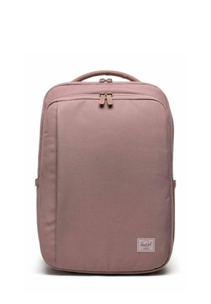 Zaino rettangolare color rosa polvere con manico superiore, tasca frontale con zip e patch con logo del marchio Herschel in basso a destra.