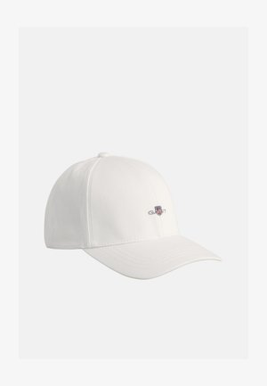 White baseball cap made of smooth fabric, featuring a stitched logo and adjustable back strap. Curved brim with tonal stitching details.
