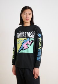 Black long-sleeve T-shirt featuring colorful graphic design: "MANASTASH" text and a pink and blue running figure.  Comfortable cotton material.
