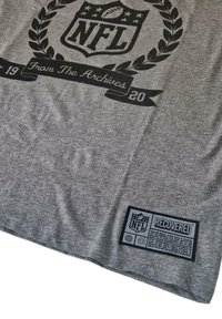 Gray t-shirt features a black NFL logo with a laurel wreath, "From The Archives 1920," and a black rectangular tag stating "RECOVERED."