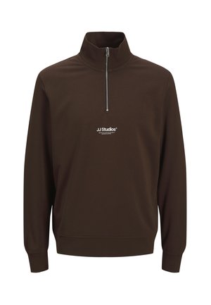 Brązowa bluza zip-up wykonana z miękkiego materiału, z wysokim kołnierzem i białym logo na piersi. Rękawy i dół wykończone ściągaczem zapewniają dopasowane uczucie.