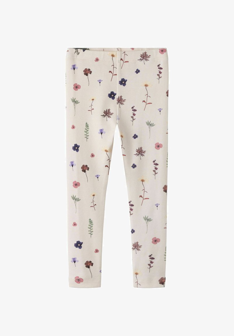 Leggings couleur crème avec un motif de petites fleurs sauvages multicolores et de feuilles vertes réparties uniformément.