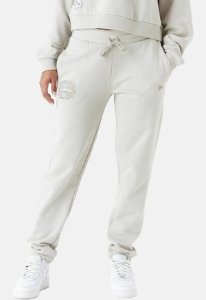 Helle beige, Fleece-Jogginghosen mit elastischem Bund und Kordelzug. Mit Seitentaschen und gesticktem "New Era"-Logo. Texturiertes Material.