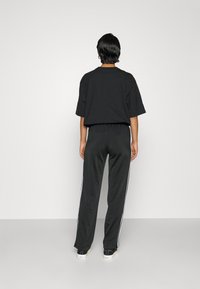 adidas Originals FIREBIRD  - Calças de fato de treino - black