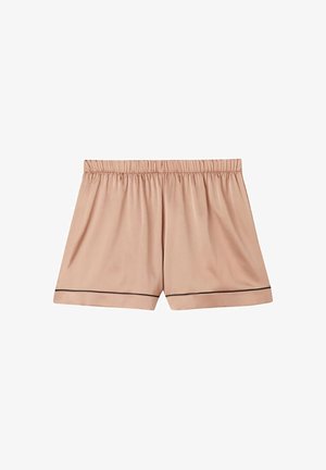 Pantalones cortos beige de tela satinada con cintura elástica y detalle de ribete negro a lo largo del dobladillo, vistos desde arriba sobre fondo blanco.