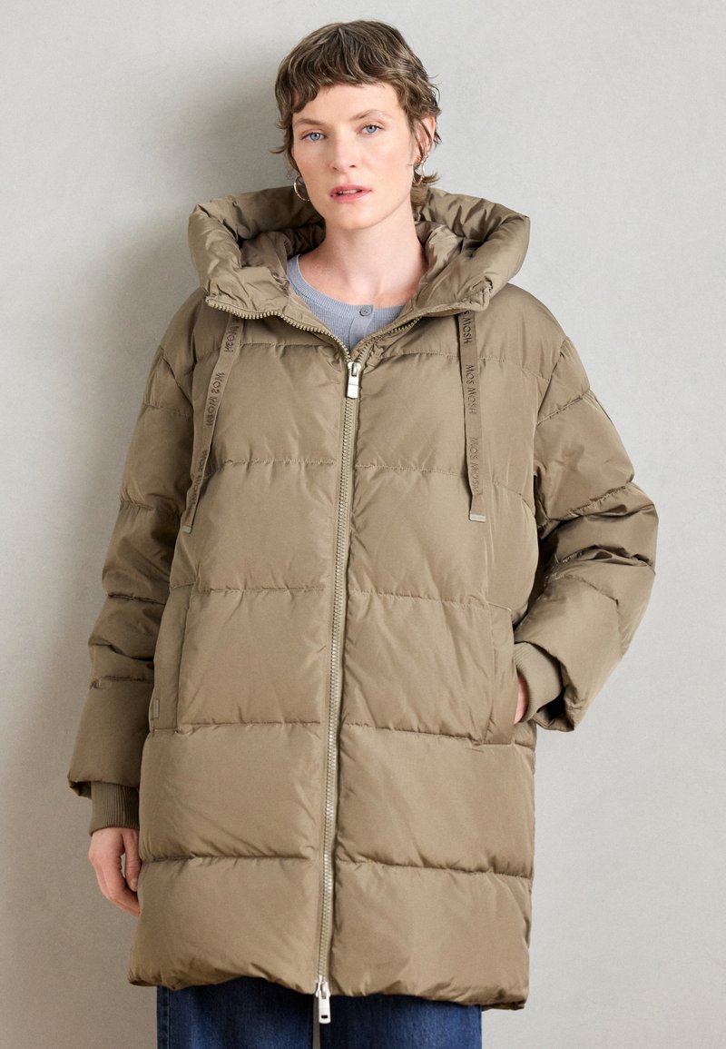 Khaki puffer coat with a large hood, zip closure, elastic cuffs, and side pockets. Features channel quilting and branded drawstrings.