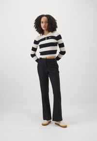 Tommy Hilfiger CORE FLARED PANT - Püksid - dark blue