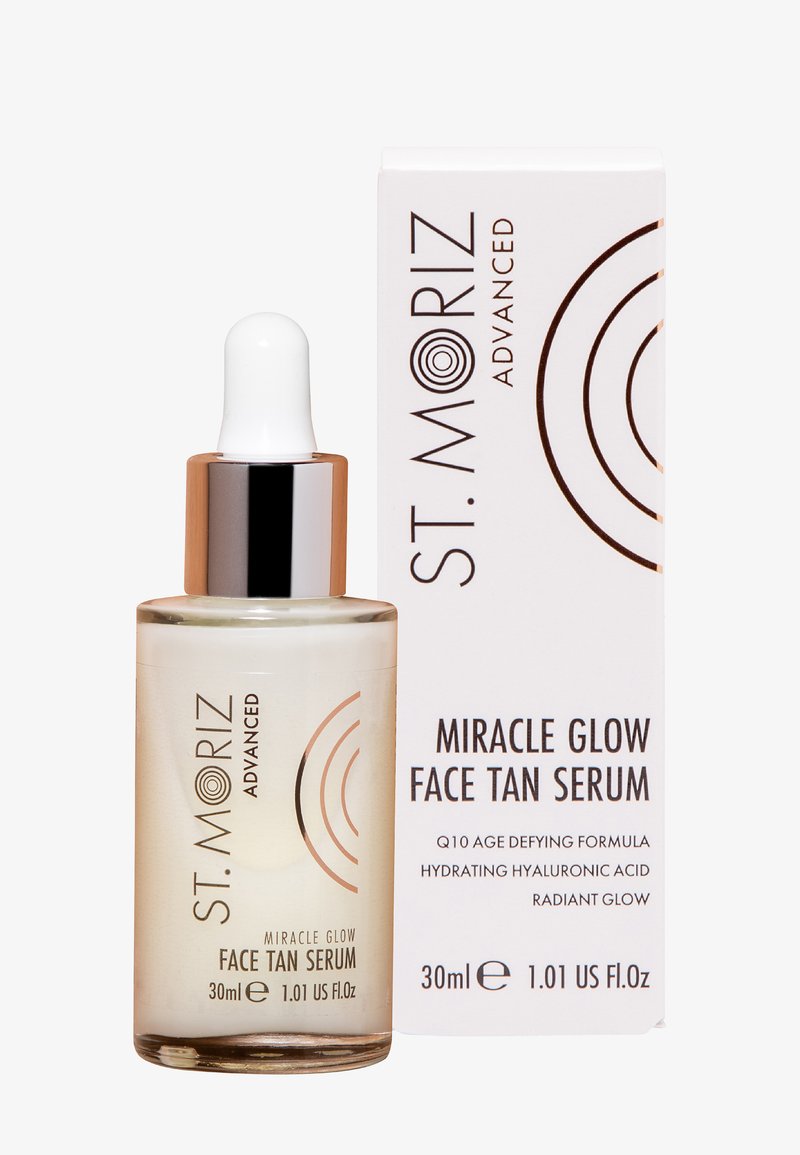 Flacon de sérum teintant visage St. Moriz Advanced Miracle Glow avec compte-gouttes à côté de sa boîte d'emballage blanche, 30 ml, pour une hydratation et un éclat radieux.