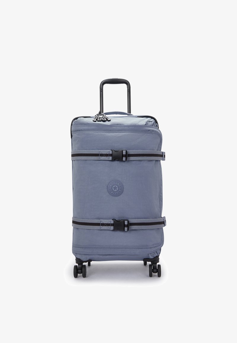 Měkký kufr v světle modré látce, vybavený teleskopickou rukojetí, čtyřmi koly a popruhy na klipy. Kulaté logo na přední straně.