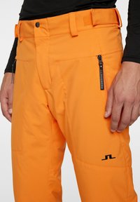 J.LINDEBERG Sports CLARKE - Pantaloni da sci - persimmon orange