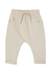 Beige Baumwollhosen mit einer weichen, strukturierten Oberfläche, ausgestattet mit einem elastischen Bund, Kordelzug, seitlichen Taschen und umgeschlagenen Säumen.