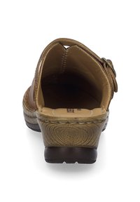 Brown leather sandal with an open back, rounded toe, and a low heel. Features visible stitching and a textured midsole. Adjustable strap detail.