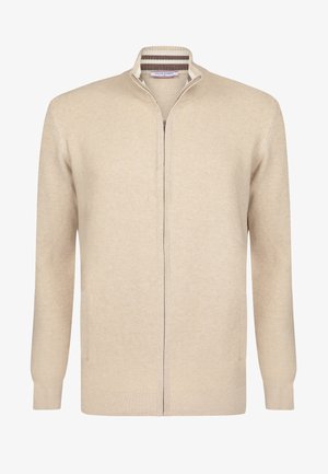 Beige knitted cardigan with a tapered collar, full zipper, and two side pockets. Textured fabric with subtle ribbing detail.