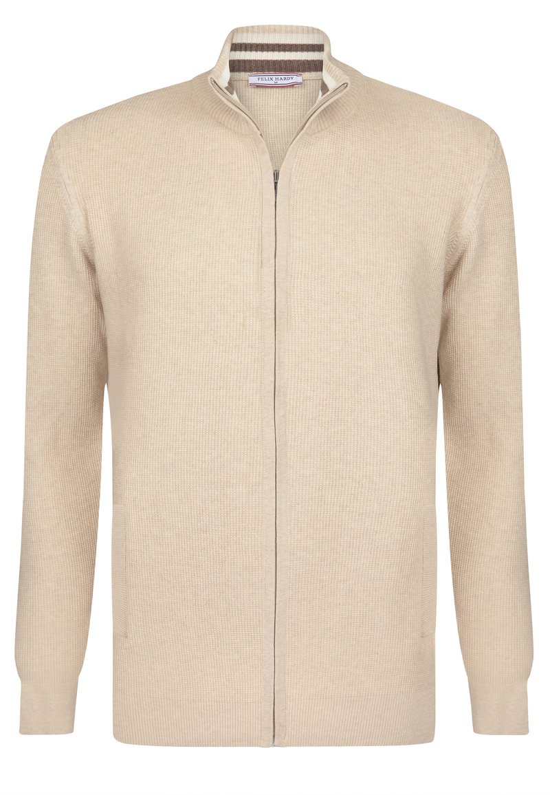 Beige gestrickte Strickjacke mit schmalem Kragen, vollem Reißverschluss und zwei Seitentaschen. Strukturiertes Gewebe mit subtilen Rippdetails.