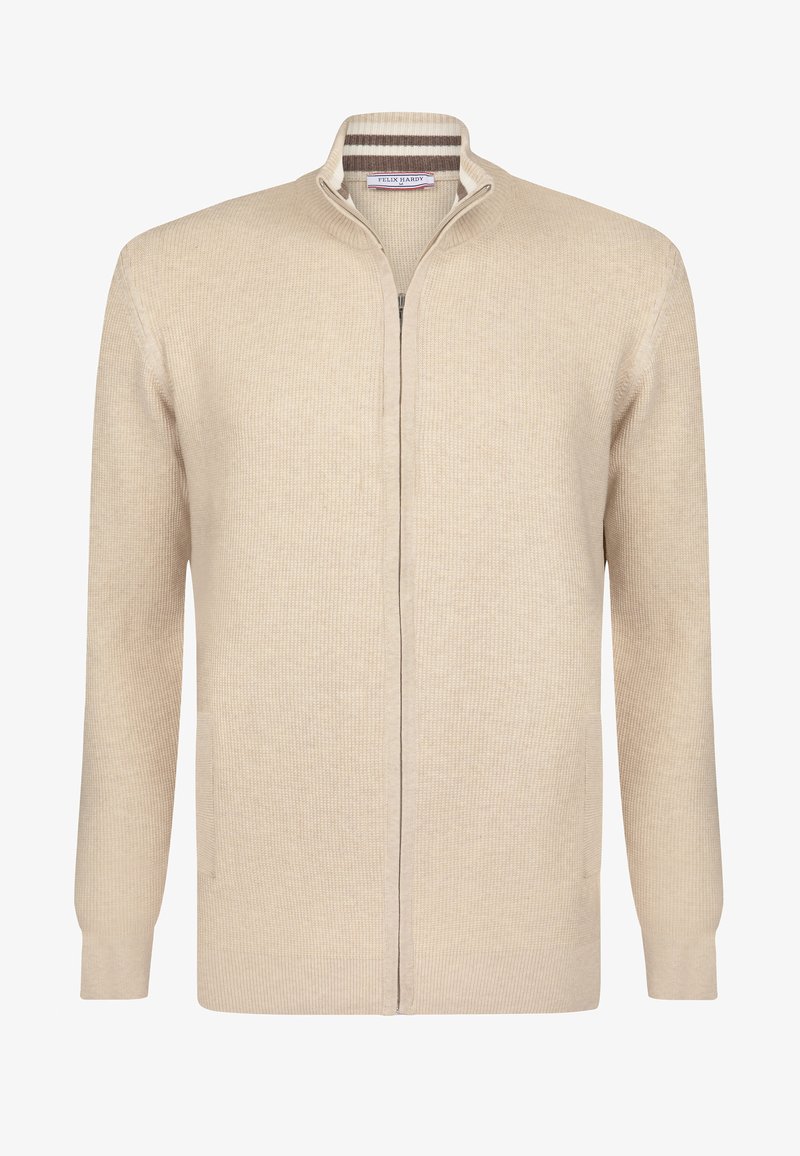 Beige gestrickte Strickjacke mit schmalem Kragen, vollem Reißverschluss und zwei Seitentaschen. Strukturiertes Gewebe mit subtilen Rippdetails.