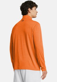 Under Armour TECH VENT GEOTESSA - Pitkähihainen paita - atomic