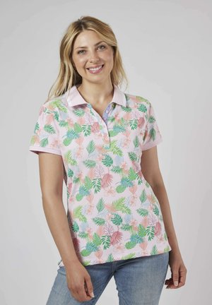 Polo en coton, avec une base rose arborant un motif floral et de feuilles de palmier dans des tons de vert, bleu et pêche. Manches courtes et col.