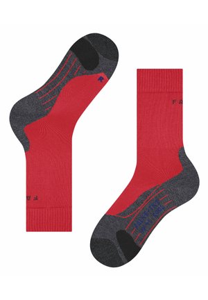 Rote und graue Socken mit geripptem Design, kontrastierender Zehen- und Fersenpartie sowie strukturierten Mustern an den Seiten. Der Schriftzug "FIGHT THE R" ist sichtbar.