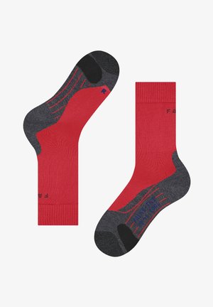 Rote und graue Socken mit geripptem Design, kontrastierender Zehen- und Fersenpartie sowie strukturierten Mustern an den Seiten. Der Schriftzug "FIGHT THE R" ist sichtbar.