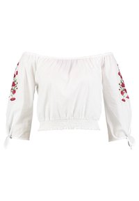 Blusa blanca de hombros al aire con cintura elástica, con bordado floral rojo en las mangas y puños atados. Tela de algodón, corte holgado.