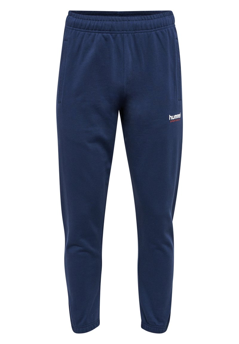 Mörkblå bomulls-joggingbyxor med dragsko i midjan, smala ben, sidofickor och en vit logotyp på nedre vänstra benet.