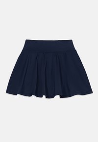 Jupe patineuse bleu marine en matériau extensible. Dotée d'une taille élastique et d'un ourlet évasé, garantissant confort et liberté de mouvement.