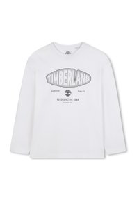 T-shirt bianca a maniche lunghe con scollatura rotonda, caratterizzata da un logo e testo stampati in nero "TIMBERLAND", realizzata in morbido cotone.