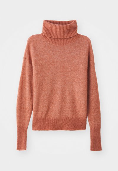 Turtleneck sweater in a soft, dusty rose color. Features ribbed texture at the collar and hem, with a relaxed fit and long sleeves.