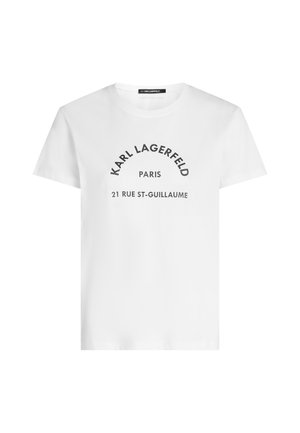 T-shirt blanc à manches courtes avec texte noir indiquant "KARL LAGERFELD PARIS 21 RUE ST-GUILLAUME" sur le devant.