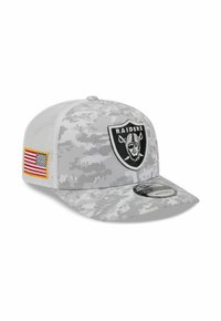 Gray digital camouflage baseball cap with a rounded visor, adjustable mesh back, black Raiders logo patch, and American flag detail.