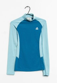 Modrý sportovní top s dlouhým rukávem a vysokým límcem, s světle modrými akcenty a přiléhavým střihem. Menší logo na hrudi.
