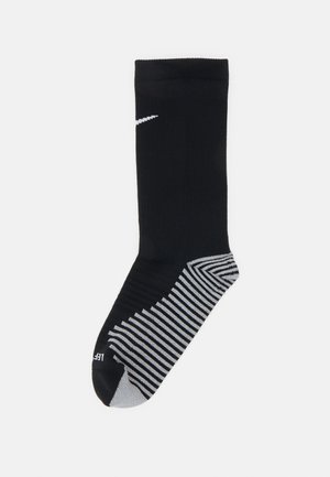 Ciorap sport negru cu o parte superioară groasă și ribbed, având călcâiul și vârful gri, cu un model în dungi pe talpă și un mic logo alb.