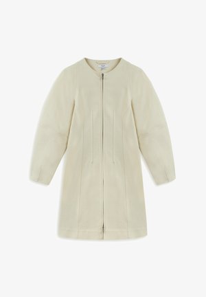 Light beige coat with a rounded neckline, full-length sleeves, center zipper, and vertical seams for structure. Smooth fabric texture.