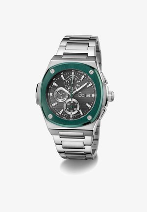 Silver metal wristwatch with a green bezel, black textured dial, subdials, and luminous silver hands. Features a stainless steel link bracelet.